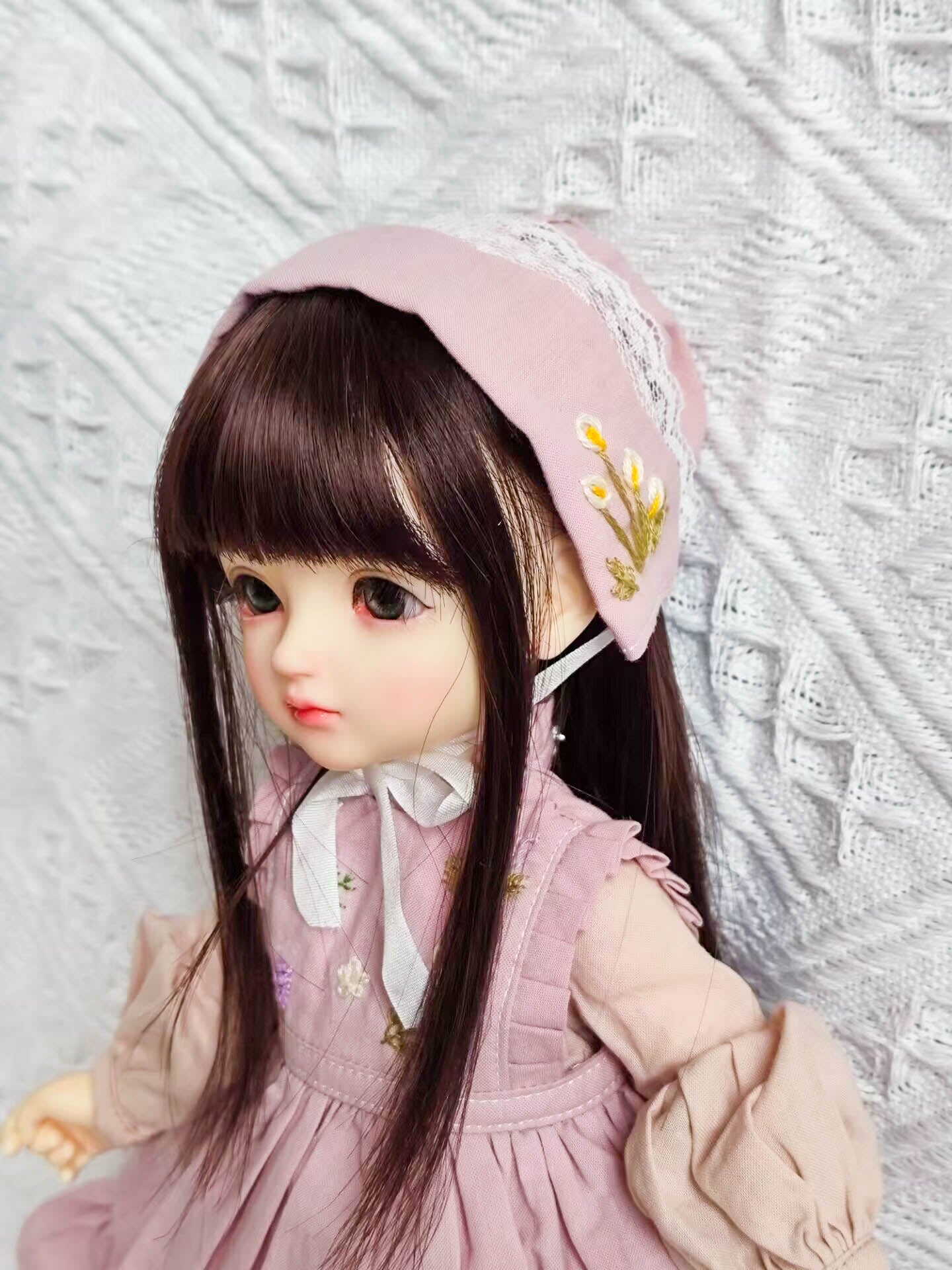 Close-up of 1/6 BJD YoSD doll clothes, upper body details and embroidery.