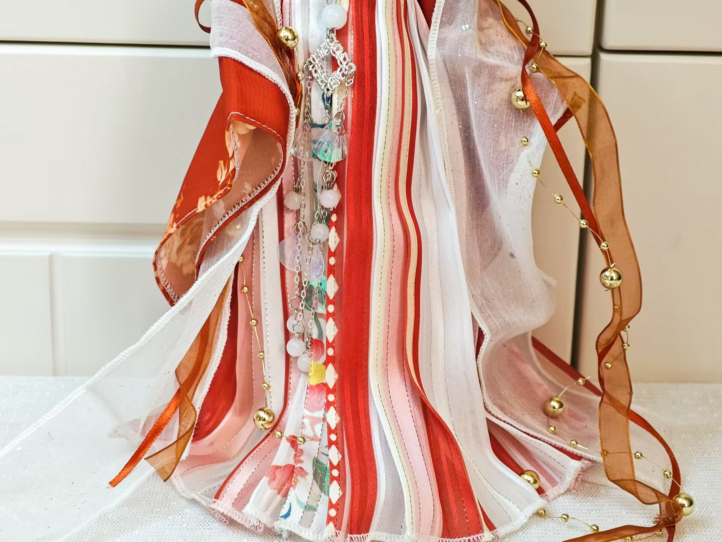 Lower body view of 1/6 BJD YoSD doll clothes, red Hanfu skirt construction.