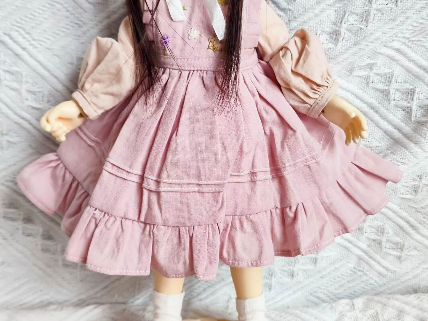 Detail view of 1/6 BJD YoSD doll clothes, floral print skirt and hem texture.