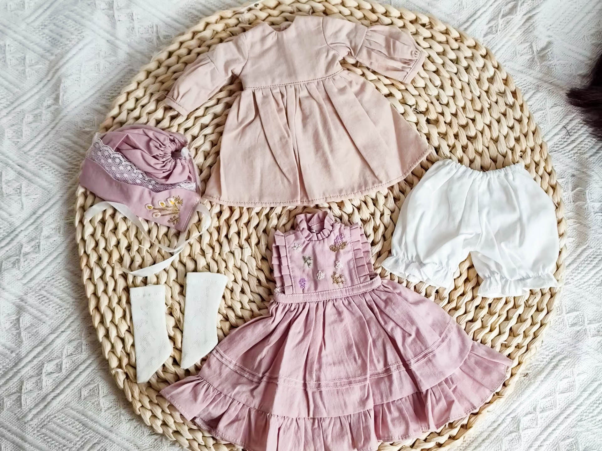 Flat lay photography of 1/6 BJD YoSD handmade prairie pinafore dress and bonnet set.