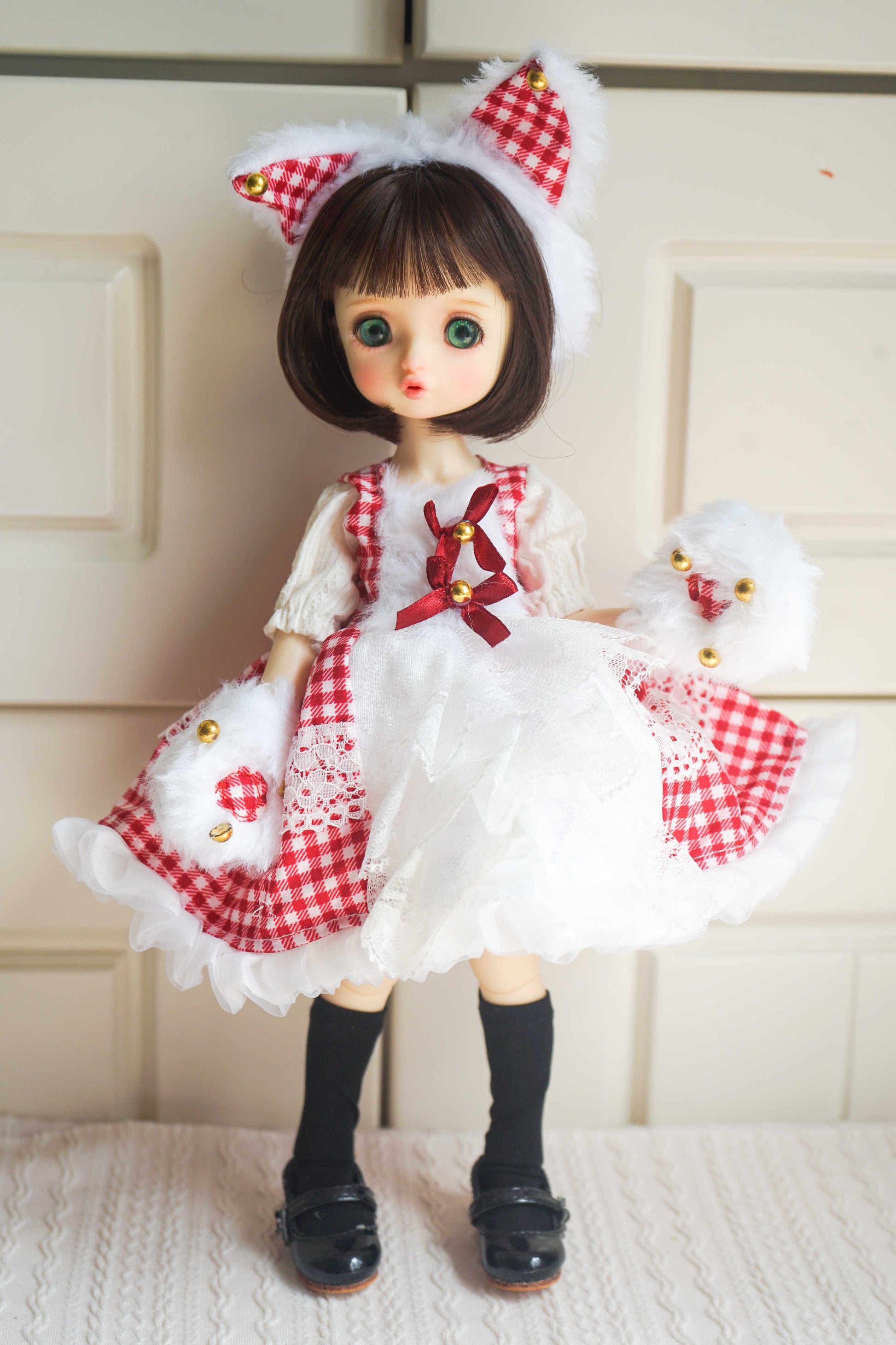 1/6 BJD YoSD doll wearing a handmade red gingham Lolita princess dress with cat ears and paw gloves.