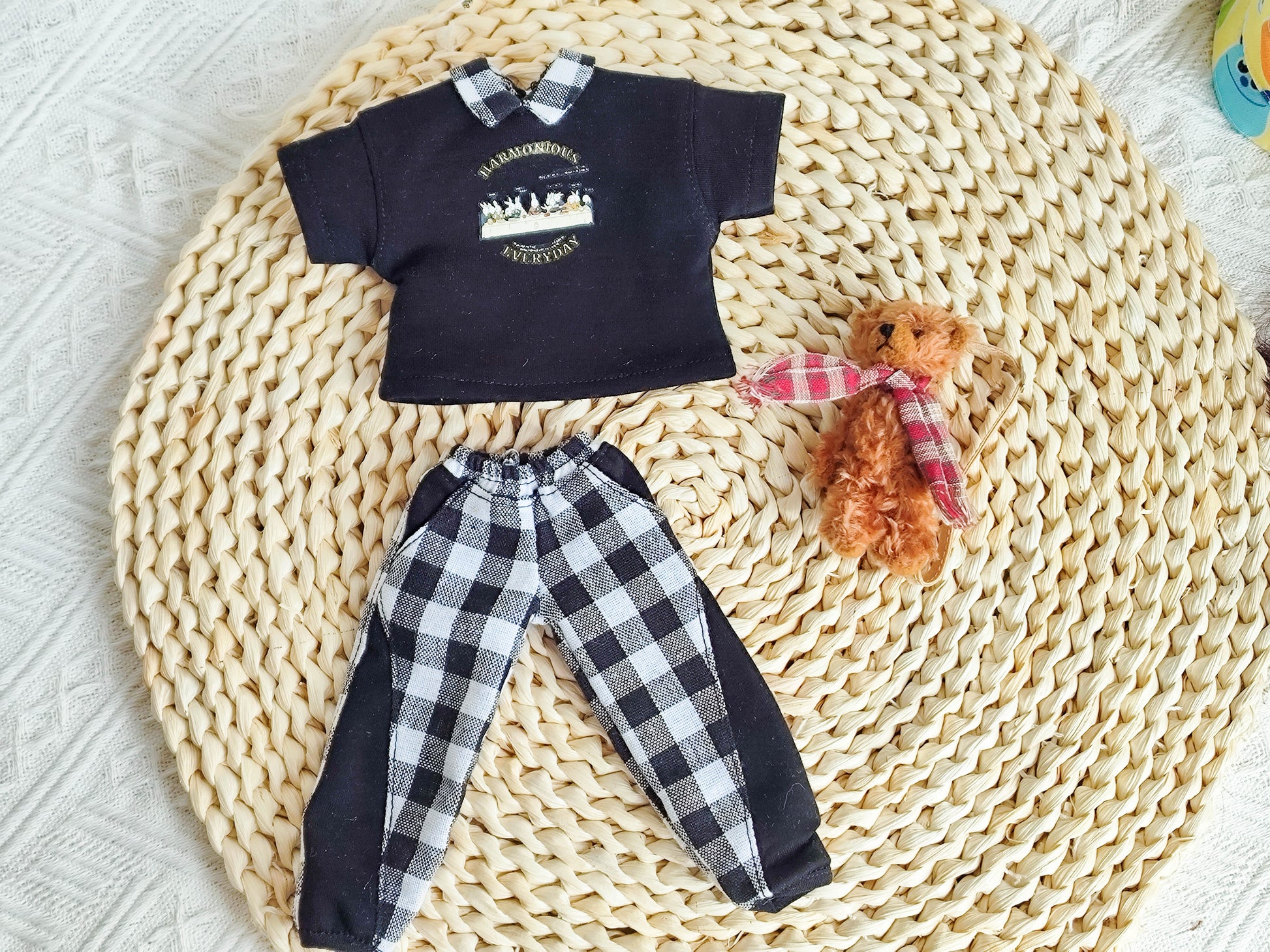 Flat lay of a 1/6 BJD YoSD doll casual set including t-shirt, checkered pants, and accessories.