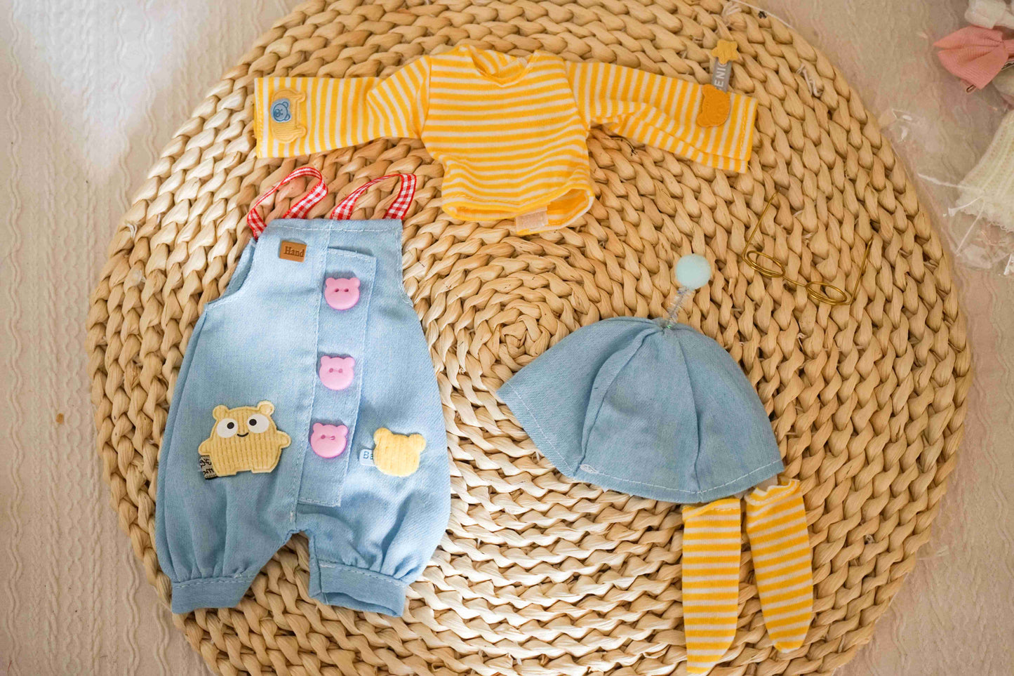 Flat lay of a complete 1/6 BJD YoSD doll outfit including shark hat, overalls, striped top, and socks.