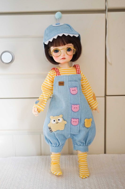 Front view of a 1/6 BJD YoSD doll wearing a shark hat and denim overalls outfit.