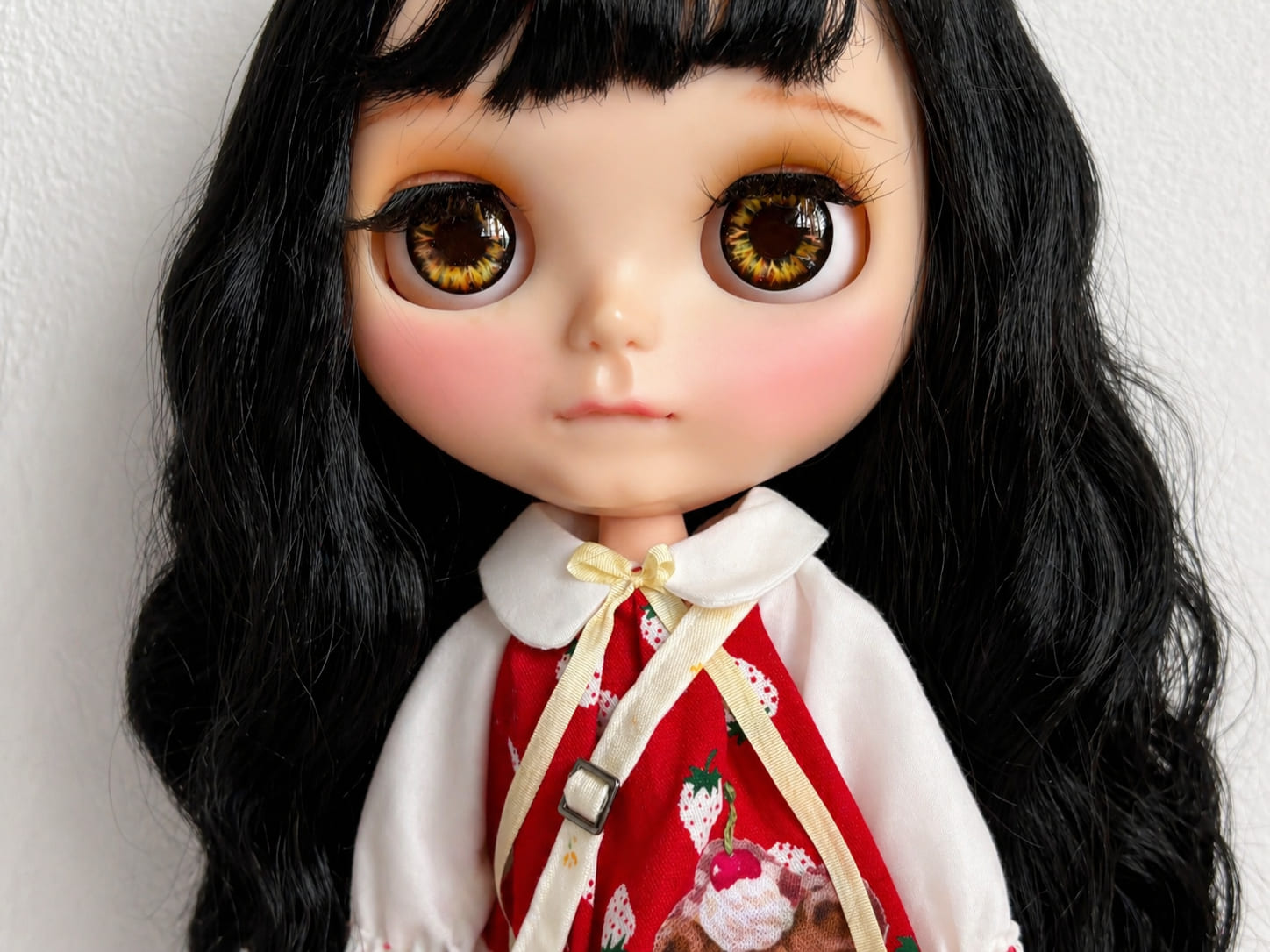Close-up portrait of a Blythe doll wearing the Strawberry Teddy Bear Christmas dress outfit.