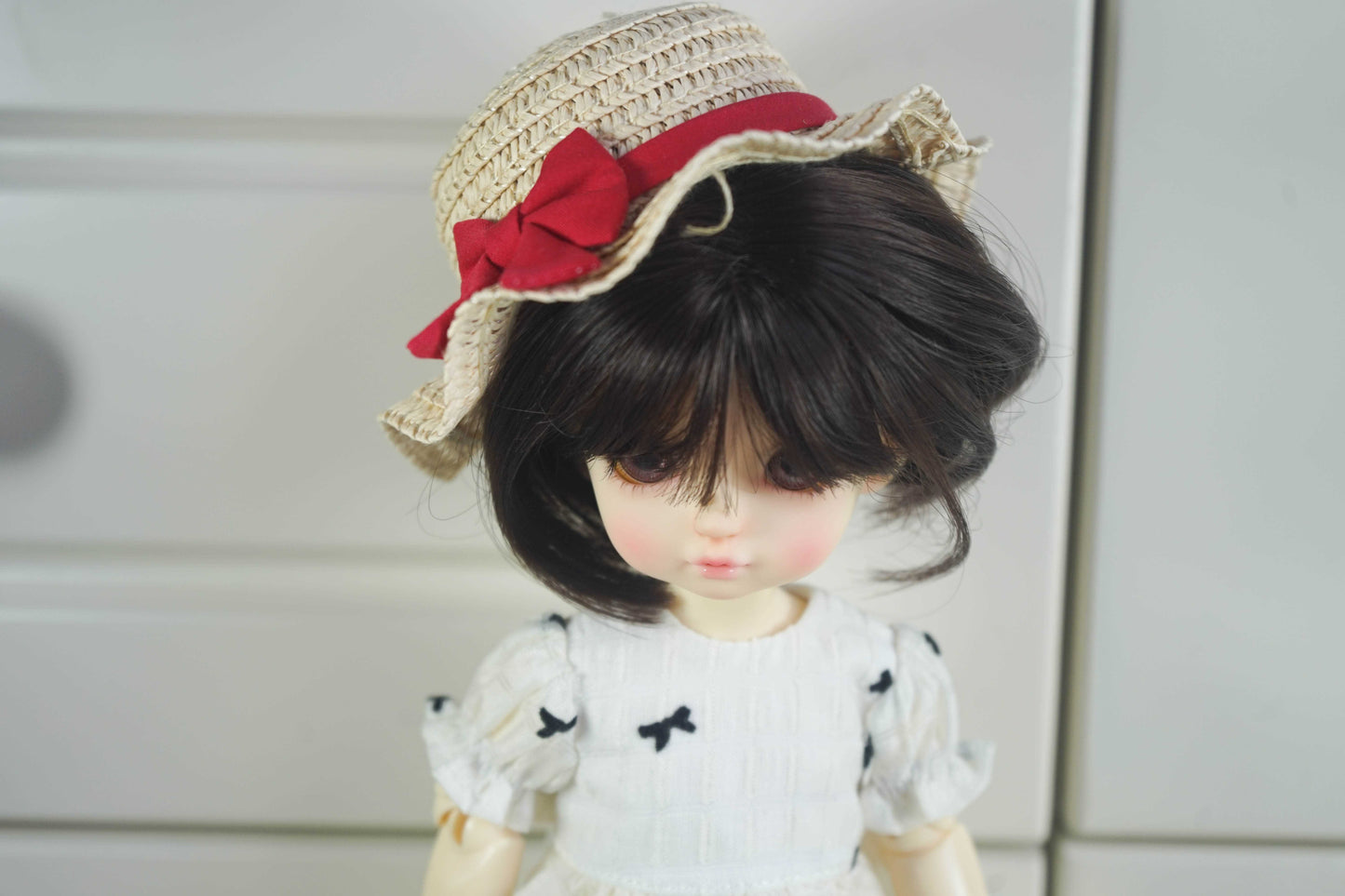 Detailed view of the puff sleeves and bodice of the coquette-style BJD doll dress.