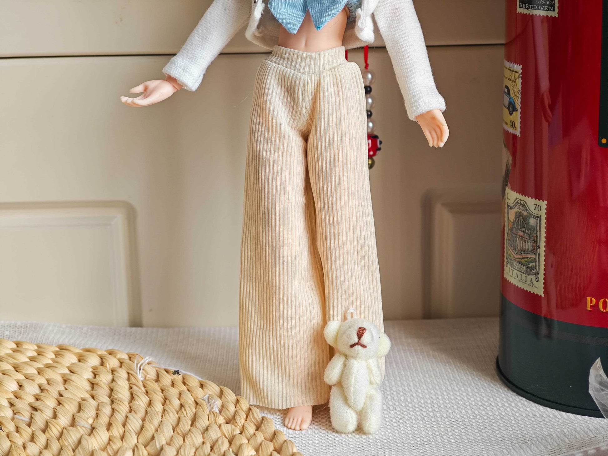 Front view of Neo Blythe doll wearing chic blue bow top and pink corduroy wide-leg pants.