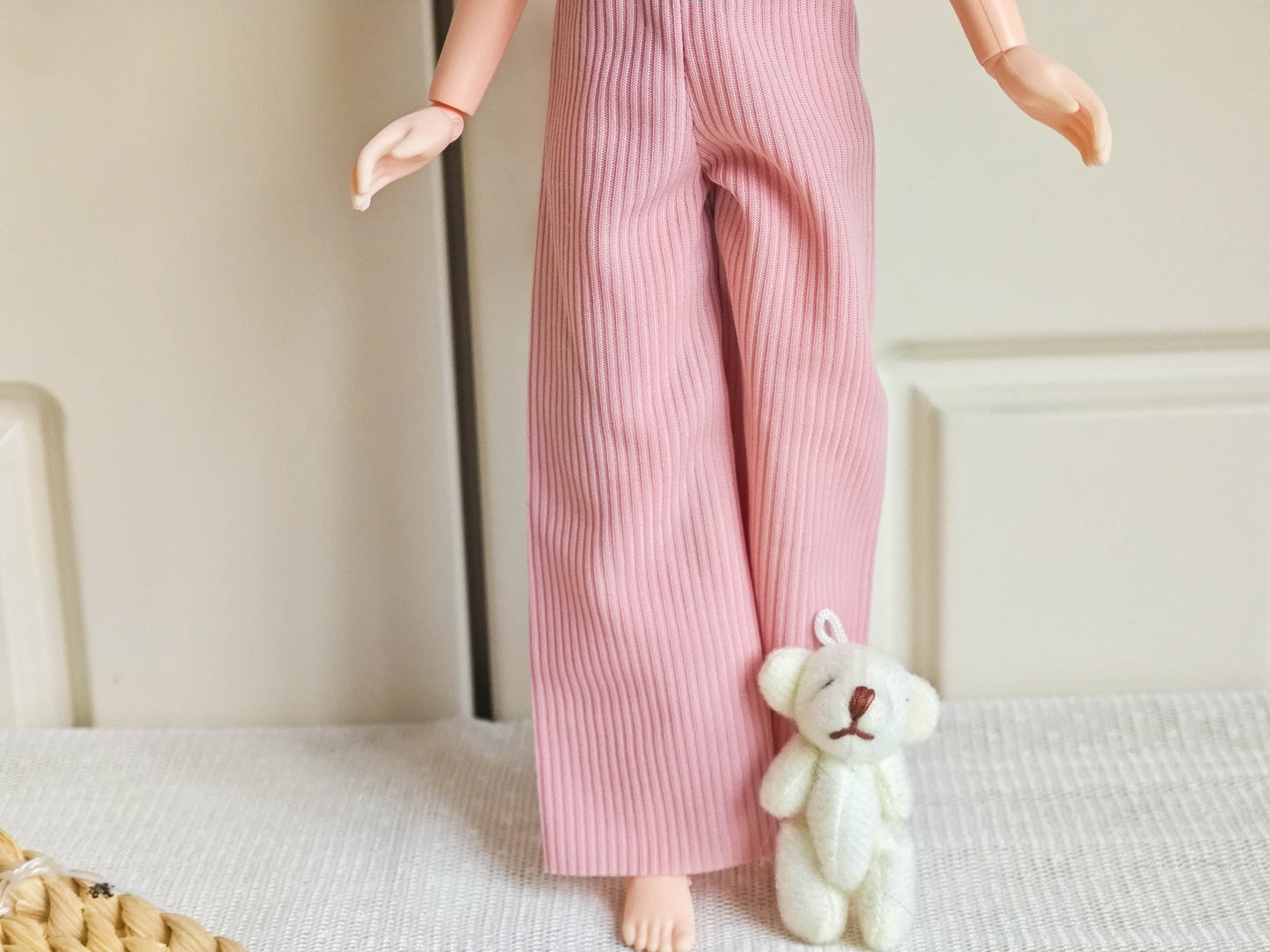 Front view of Neo Blythe doll wearing chic blue bow top and pink corduroy wide-leg pants.