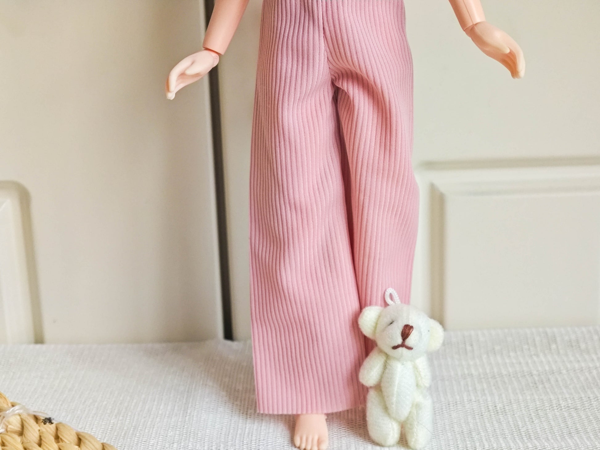 Front view of Neo Blythe doll wearing chic blue bow top and pink corduroy wide-leg pants.