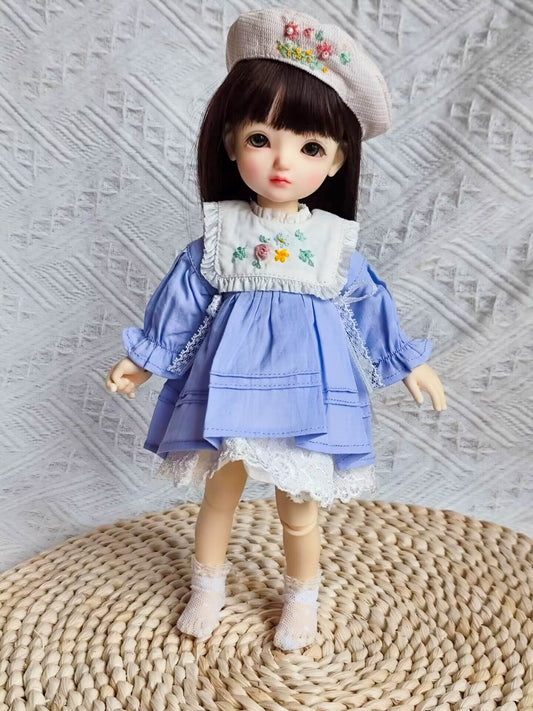 1/6 BJD YoSD doll wearing a handmade cottagecore floral embroidered bib collar dress.