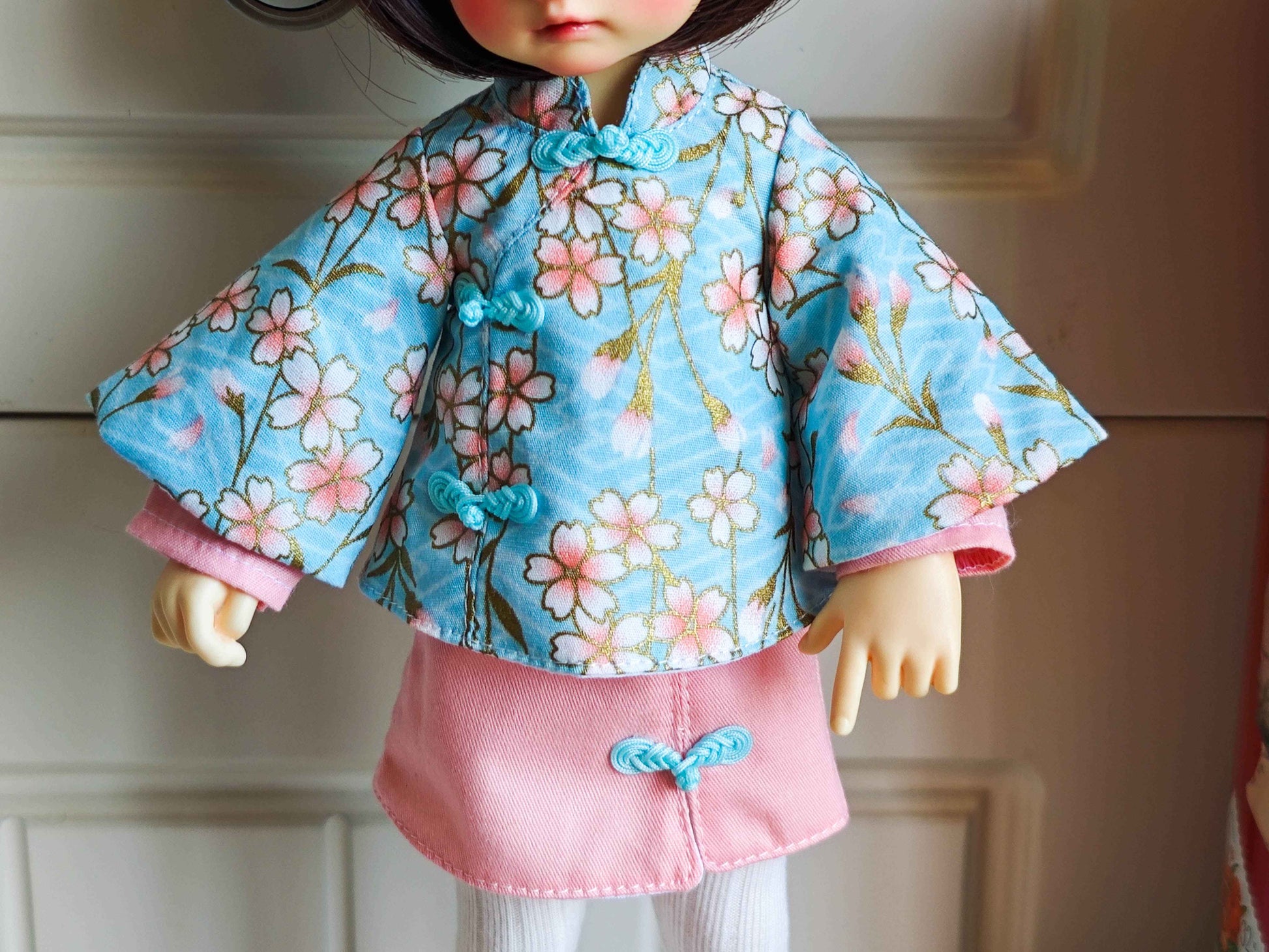 Detailed shot of the soft cotton doll short skirt and fine knit seamless doll tights.