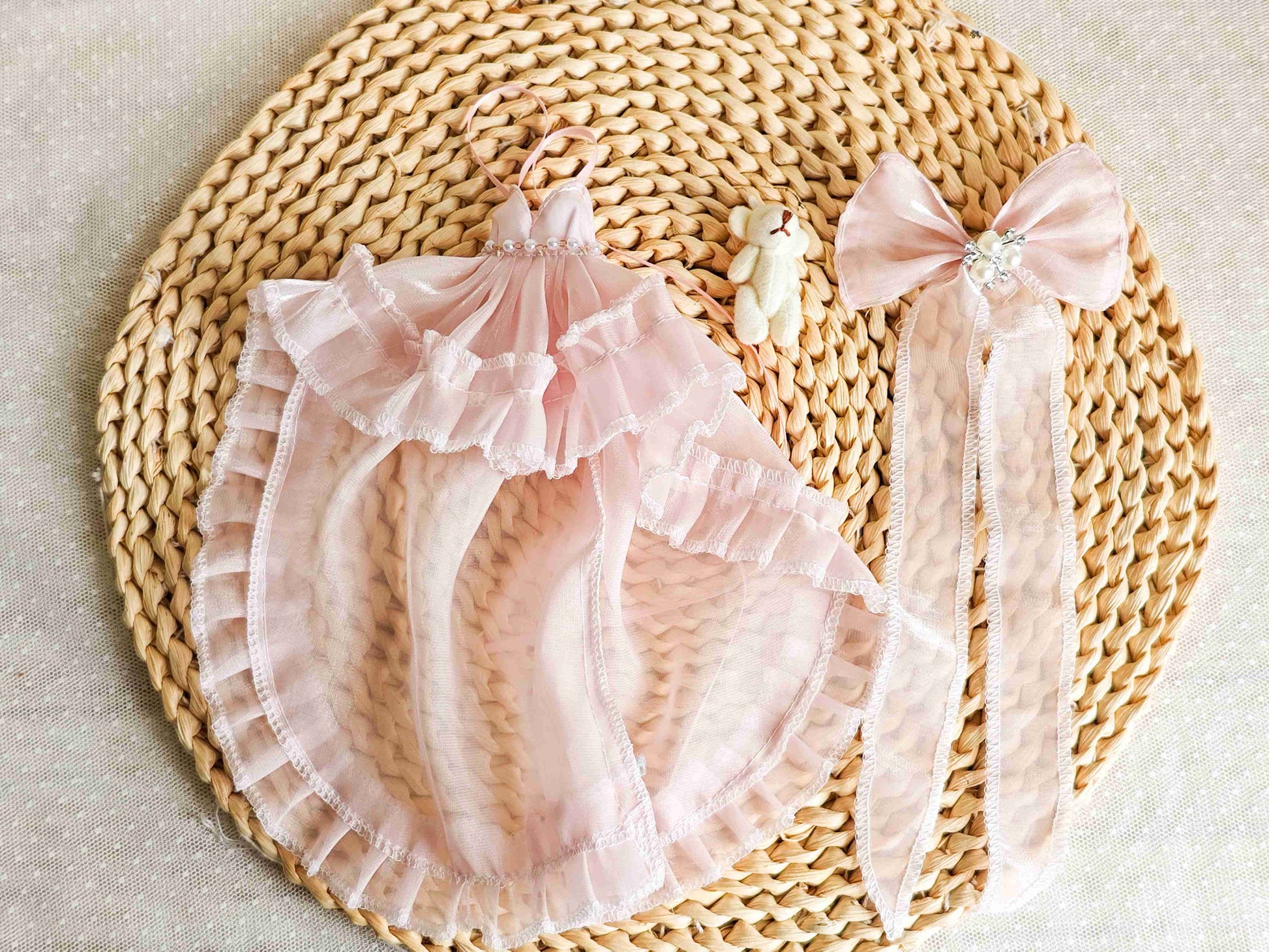 Flat lay product shot of the magnificent single piece pink fairytale princess doll gown.