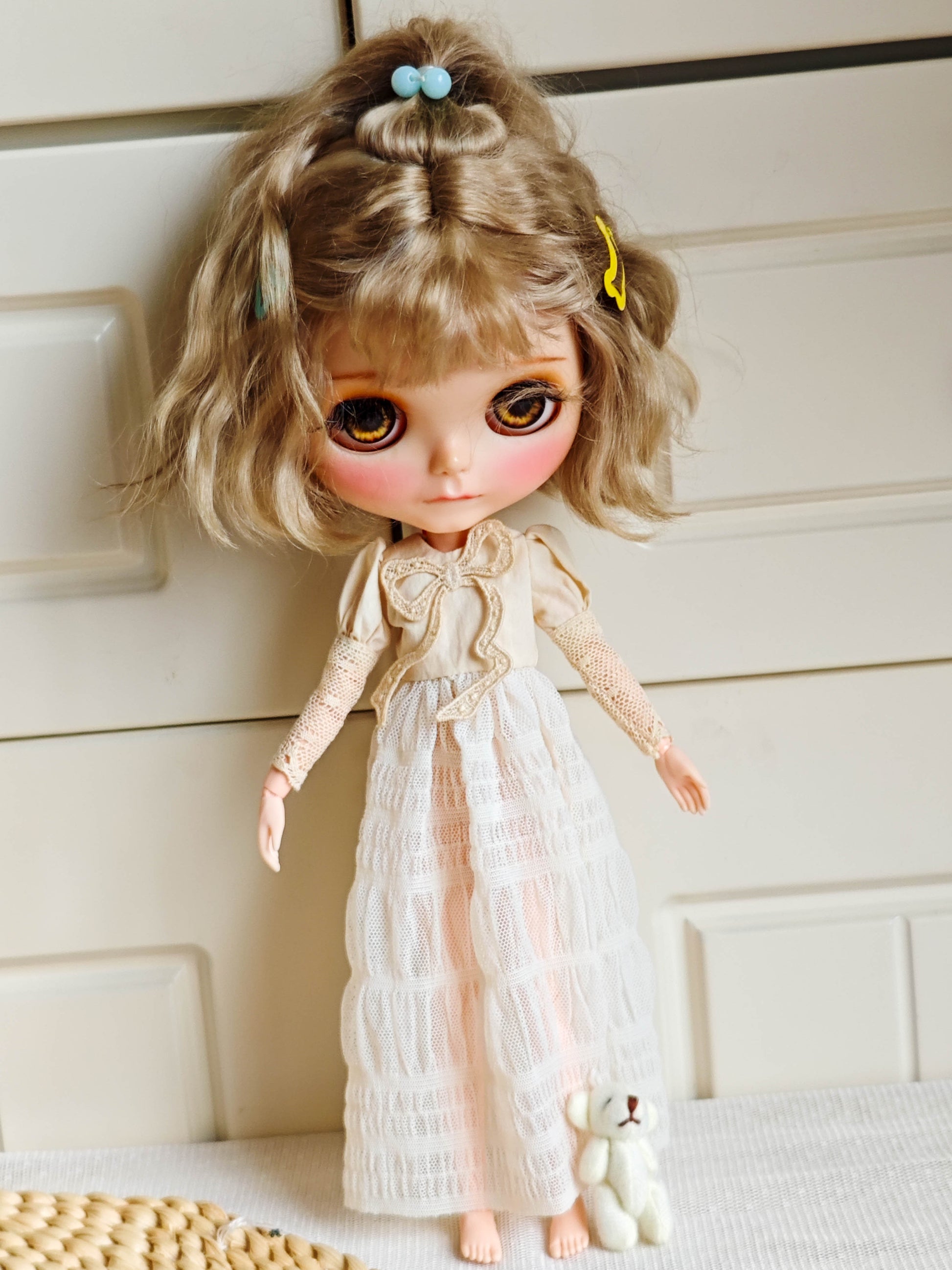 Front view of Neo Blythe doll wearing Victorian embroidered lace long dress with bow design.