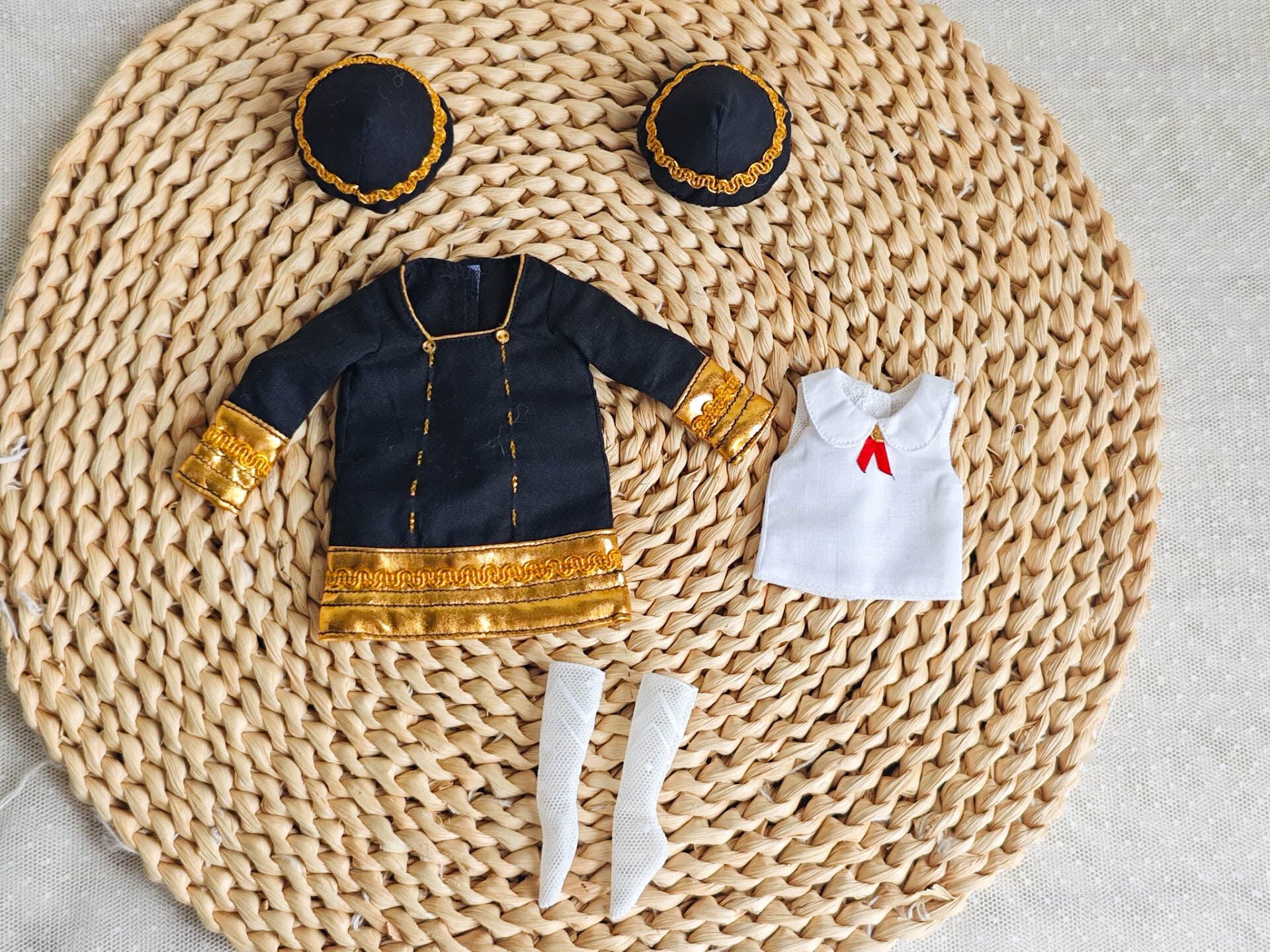 Flat lay product photography of the 4-piece Anya school uniform set including blazer, shirt, socks, and hair accessories.