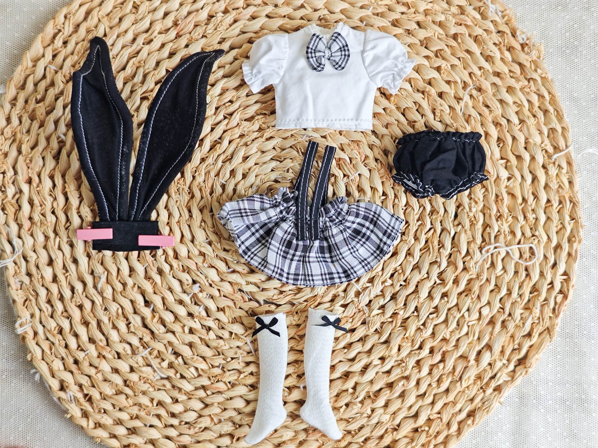 Flat lay photography of the 5-piece bunny school girl doll outfit set.