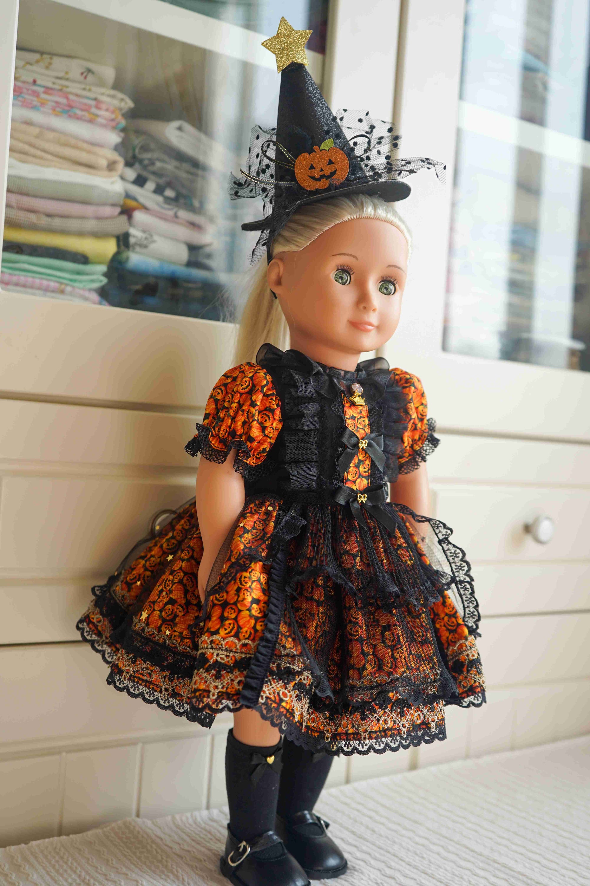 Side view of the gothic style witch dress on an 18-inch doll.