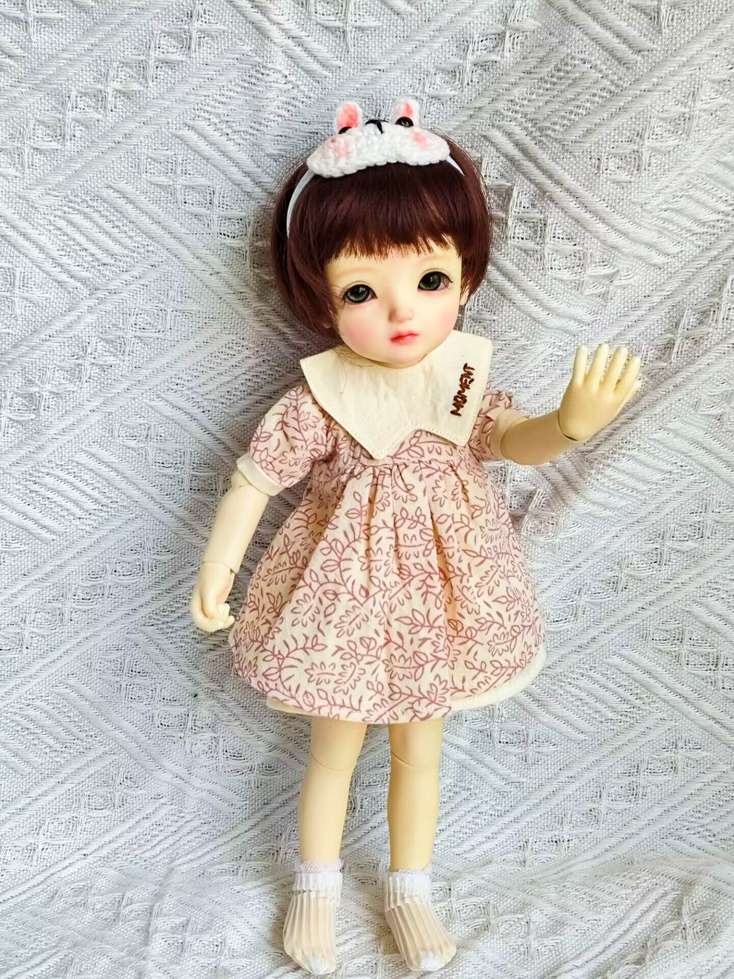 1/6 BJD YoSD doll wearing a leaf print Peter Pan collar dress outfit.