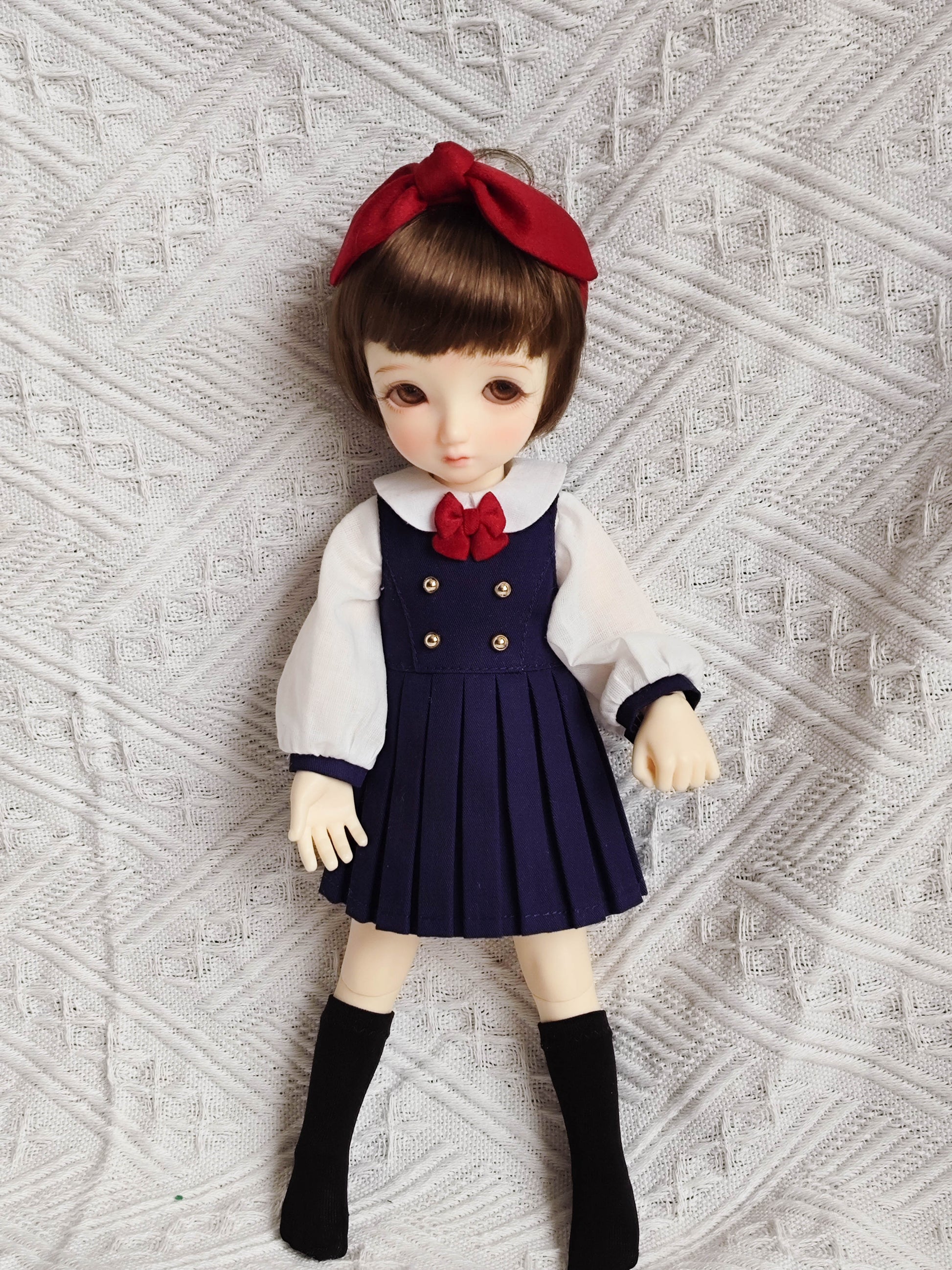 1/6 BJD YoSD doll wearing a handmade pleated school uniform outfit.