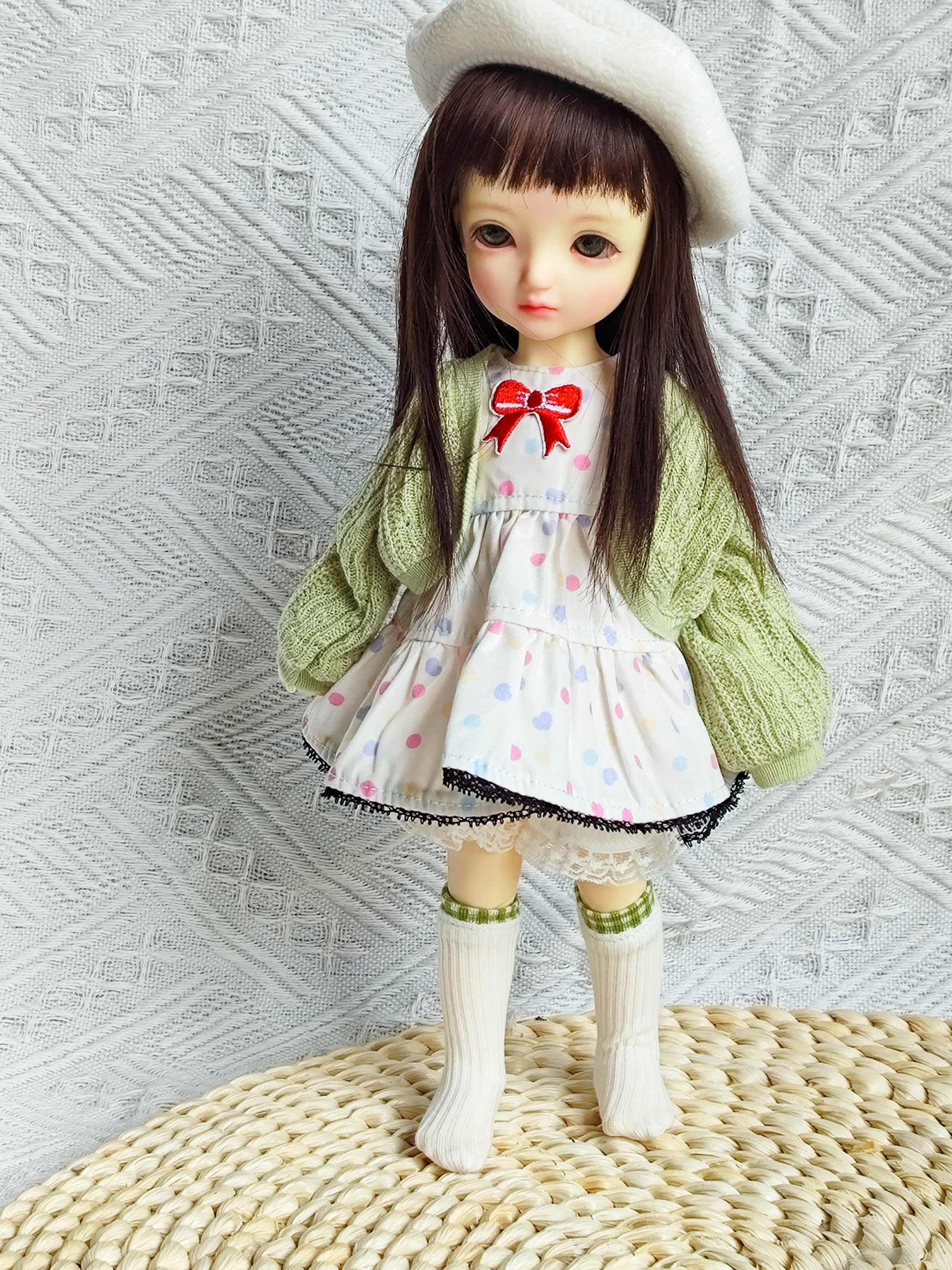 1/6 BJD YoSD doll wearing handmade polka dot dress, green cardigan, and beret.