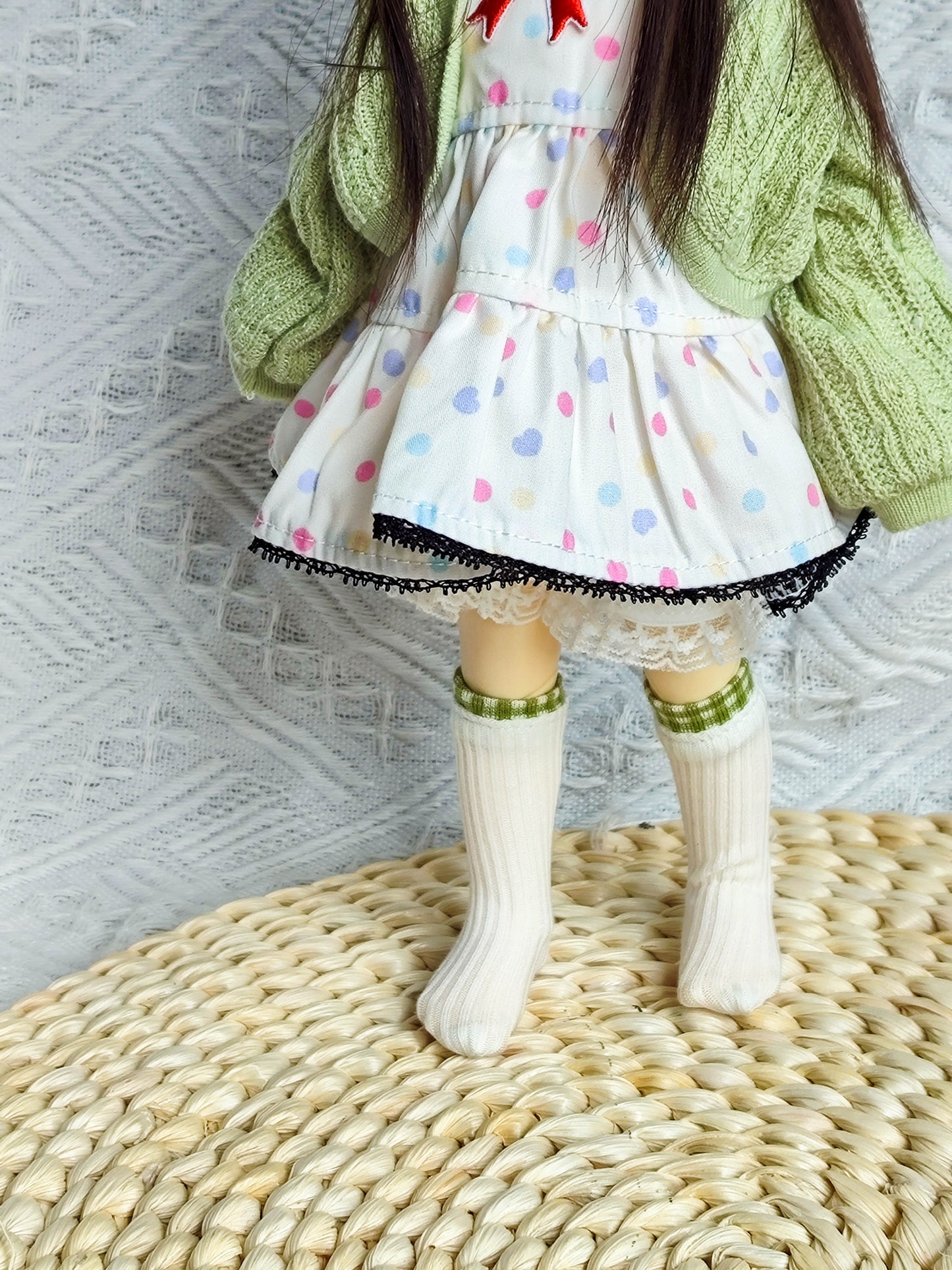 Lower body view of 1/6 BJD YoSD doll wearing polka dot dress.