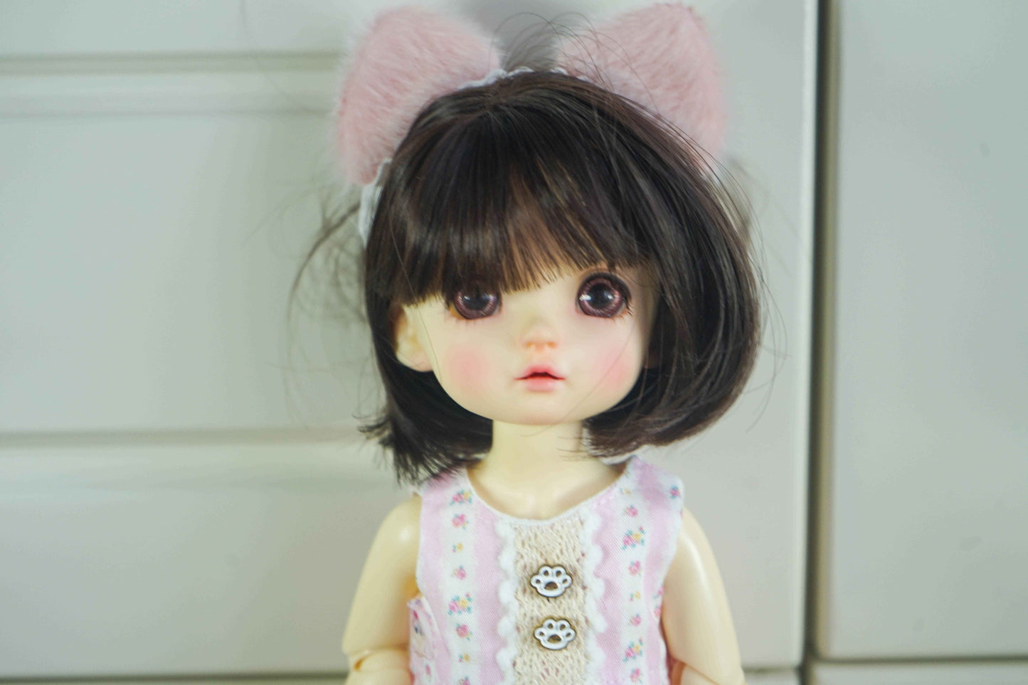 Close-up of the floral pinafore bodice and sewing detail for 1/6 BJD dolls.