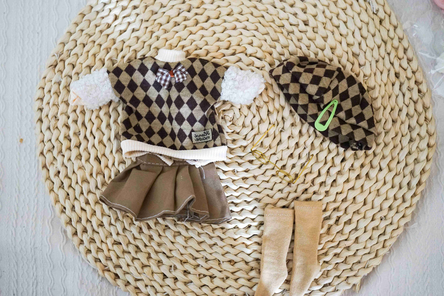 Handmade preppy argyle vest, skirt, beret, and glasses flat lay for BJD.